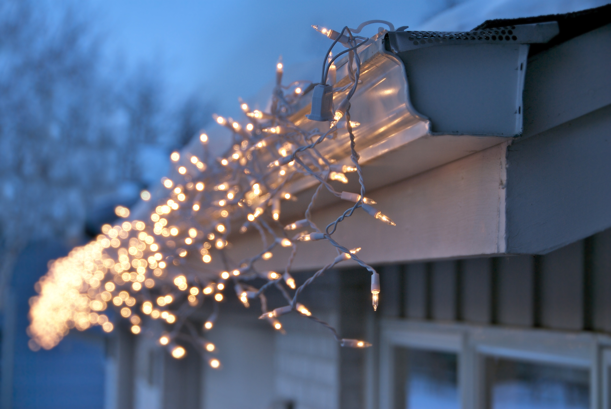Gutter installation decorated with Christmas lights